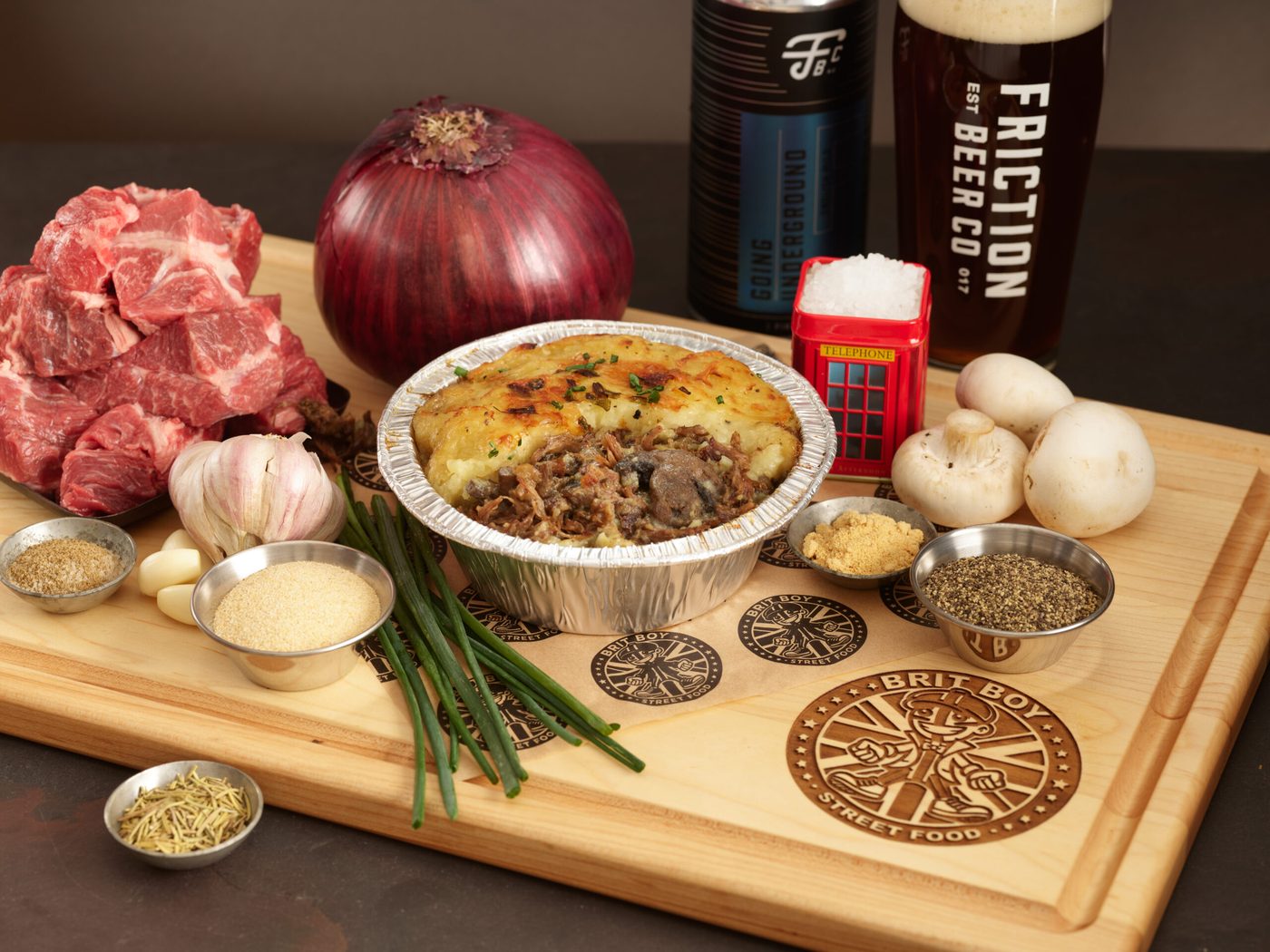 A steak, ale and mushroom pie alongside a pint