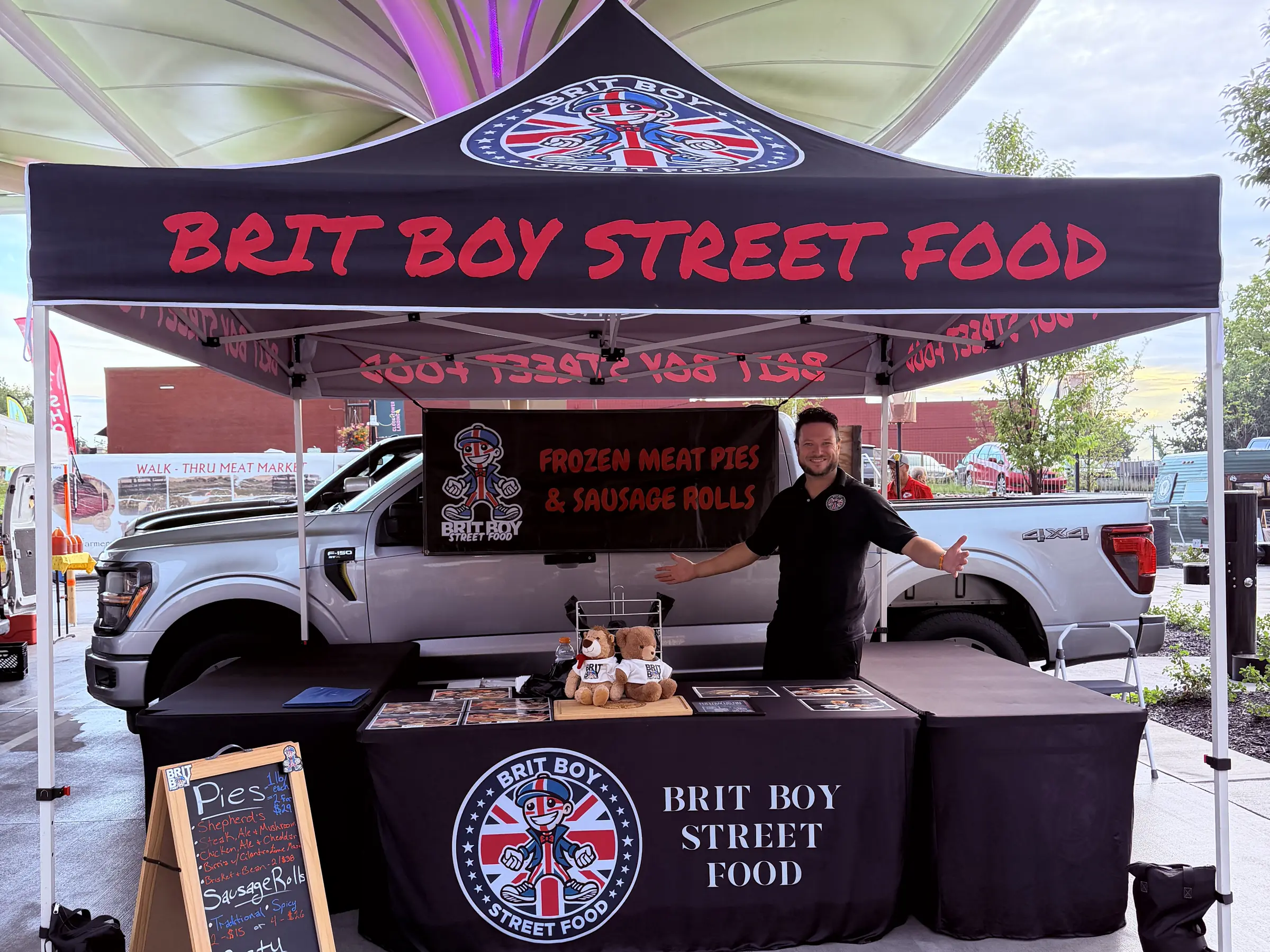 The Brit Boy Street Food stall, where the market menu and prices are set out on a chalkboard
