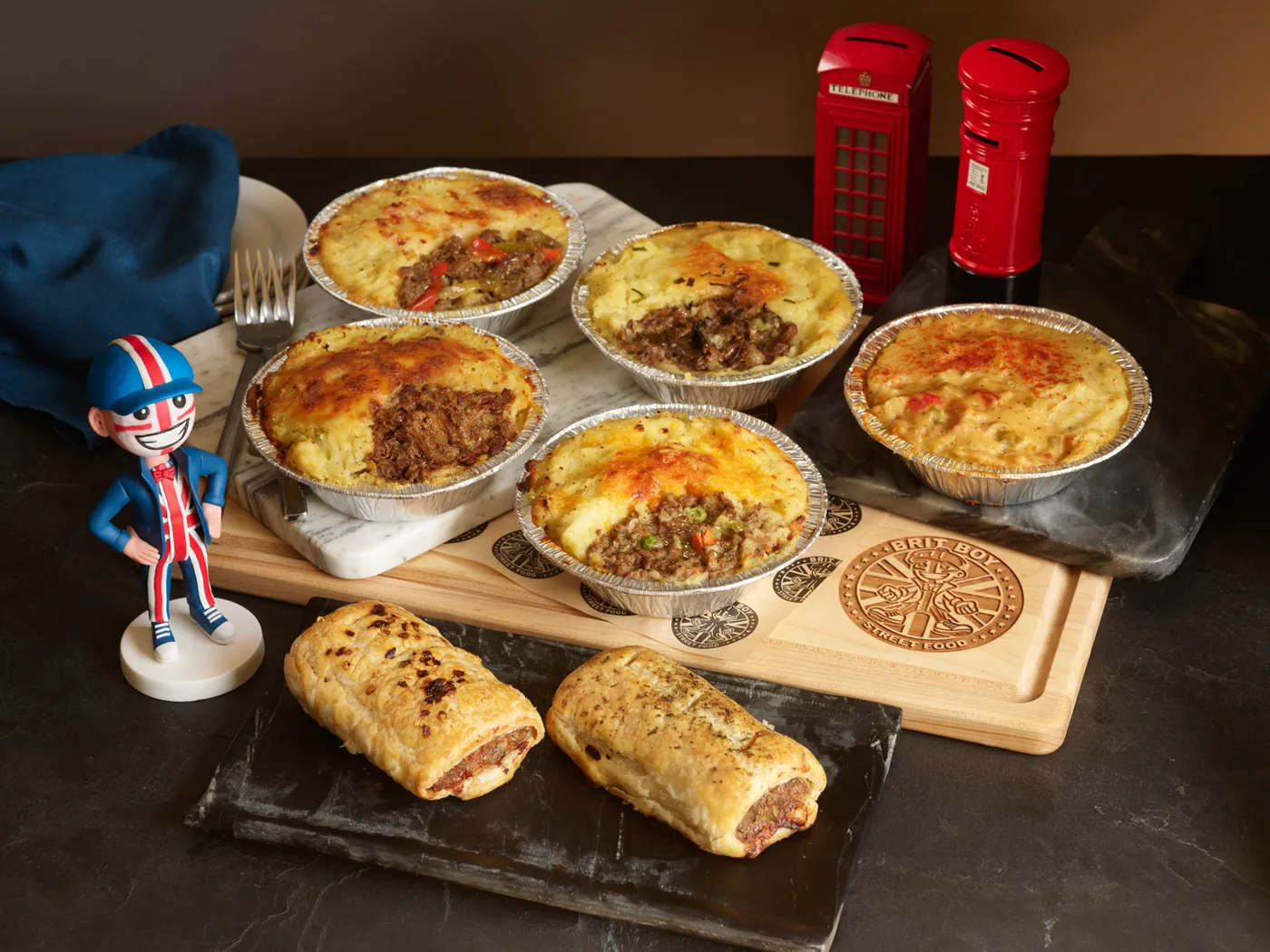 A spread of Brit Boy mash-topped pies and sausage rolls
