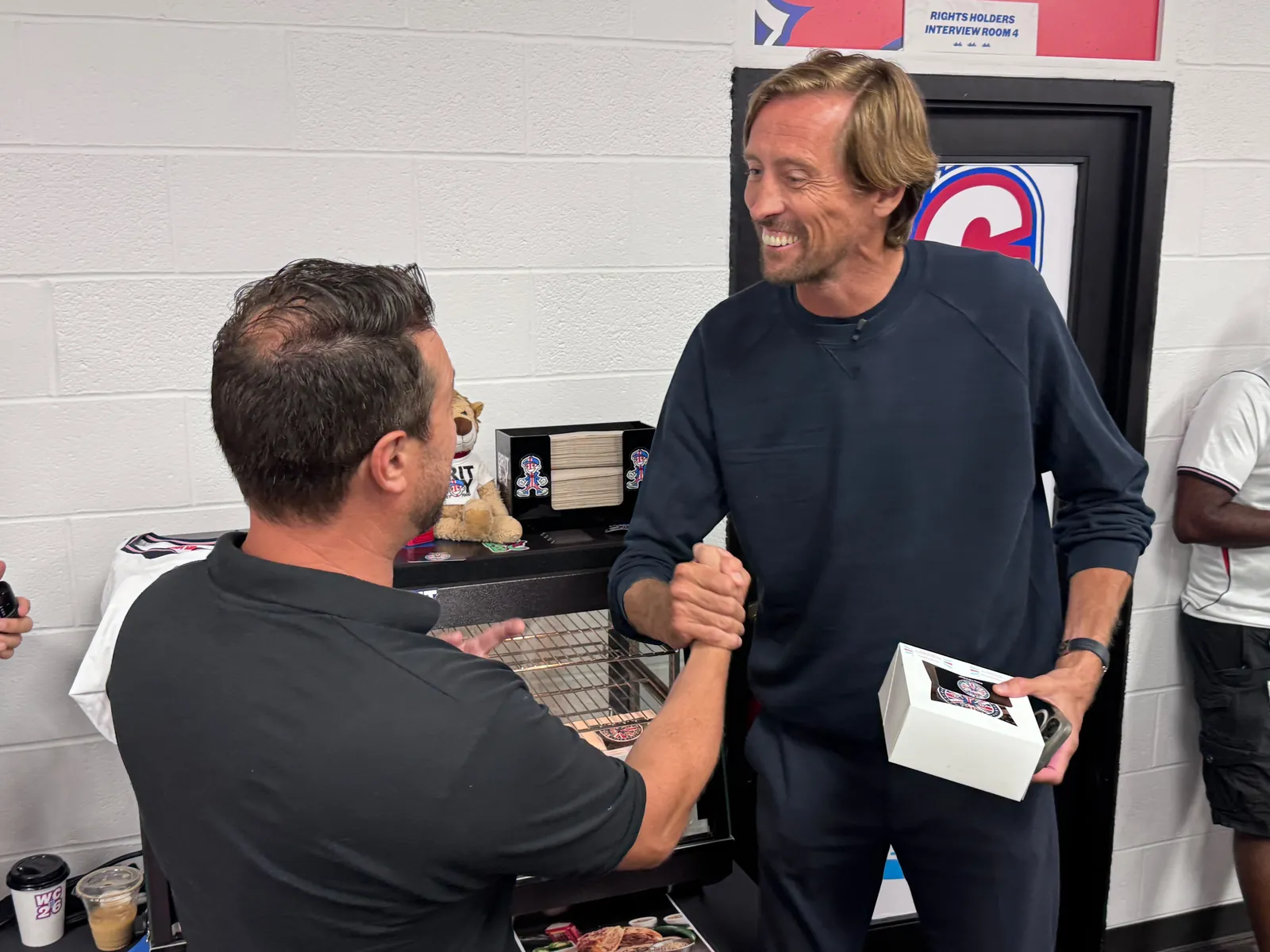 Peter Crouch collecting a box of sausage rolls