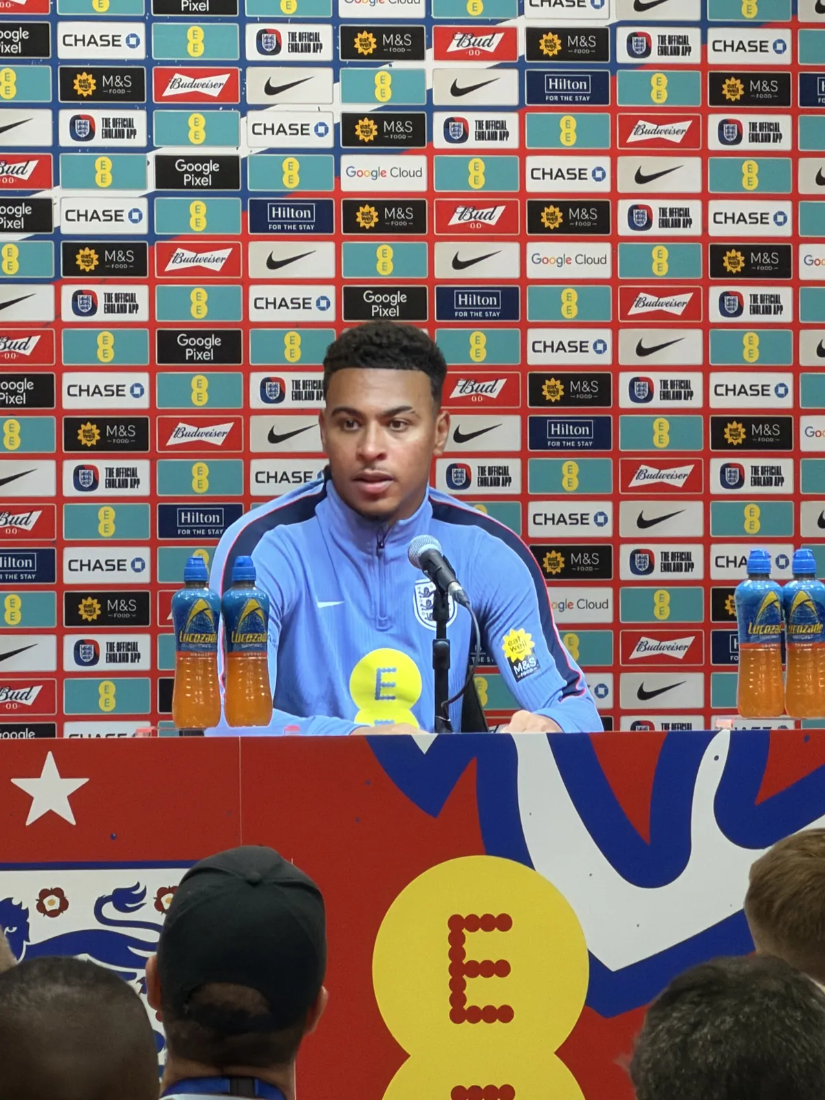 A player facing the media at the press table