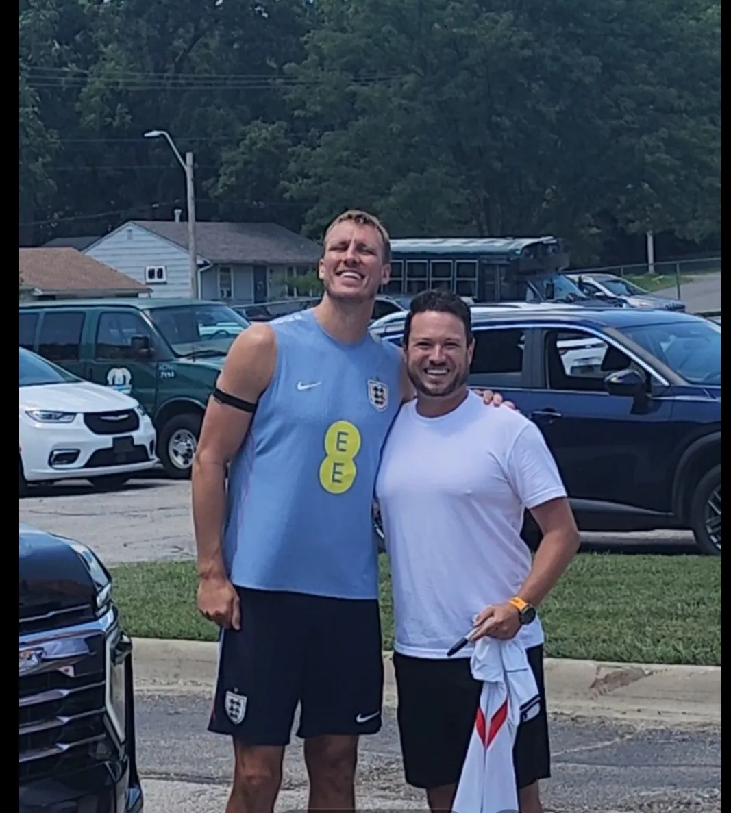 Chris Thomas with an England player