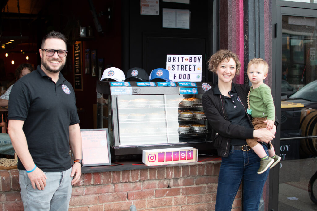 Owner of Brit Boy Street Food, Chris Thomas with his family, proudly standing outside a brewery pop up.