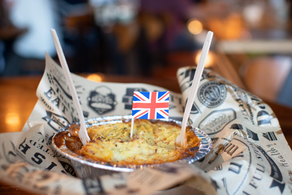 Brit Boy Street Food Shepherd's Pie ready for a happy customer with a fork and mini British flag