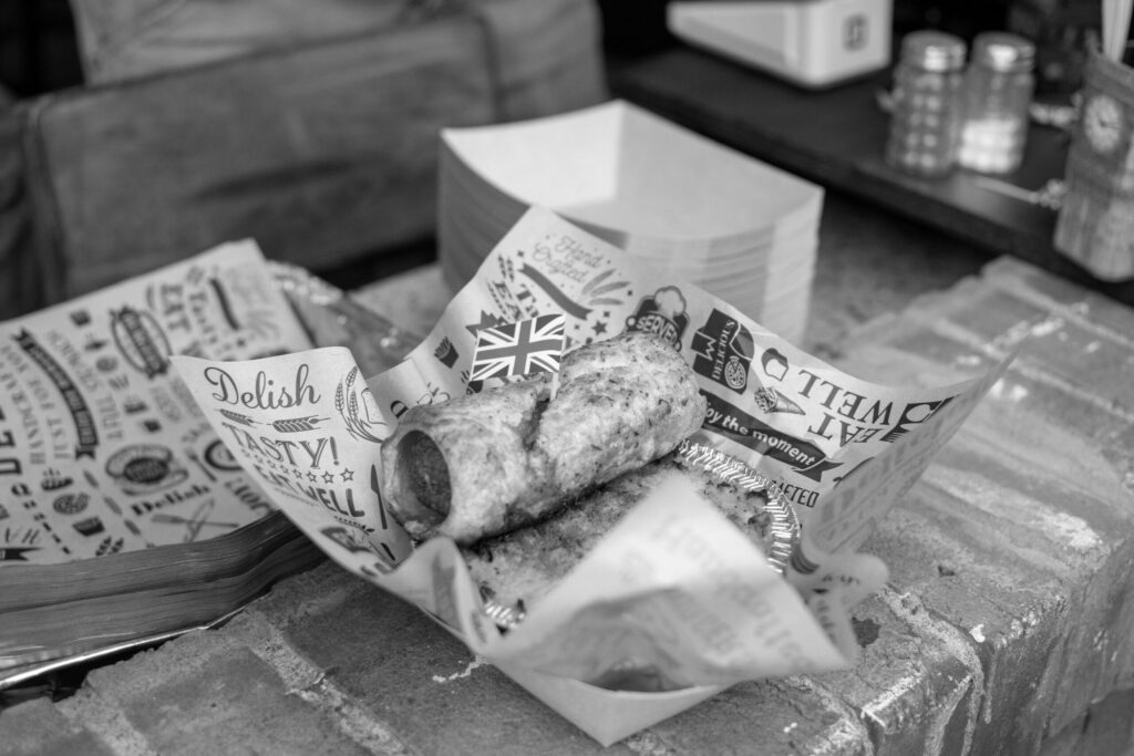 Black & White photo of sausage roll ready for a happy Brit Boy customer