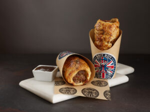 Traditional Sausage Rolls with some HP Sauce packed ready to be served